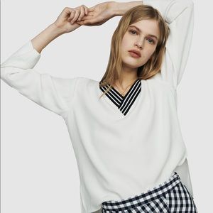 Long sleeved white blouse with black stripes